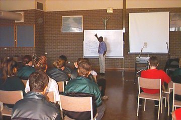 Geoffrey speaking at Aquinas